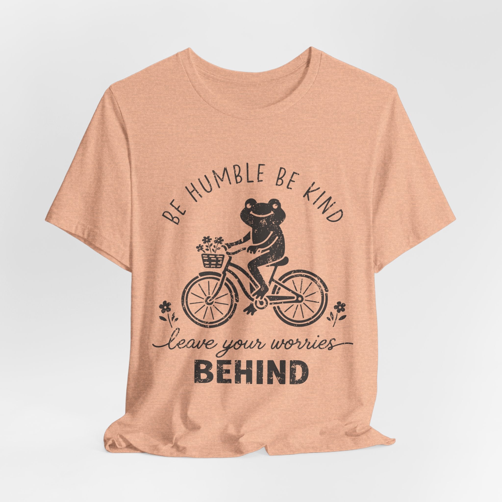 T-Shirt — "Be Humble Be Kind" Frog on Bike Graphic Tee, "Leave Your Worries Behind"