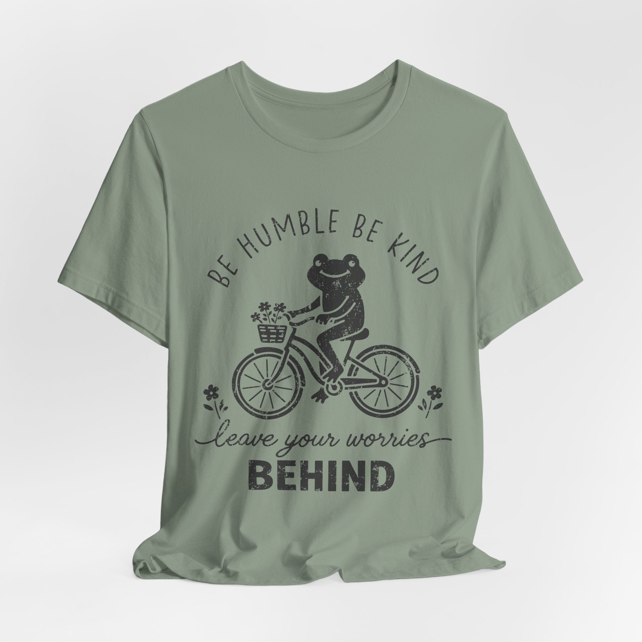 T-Shirt — "Be Humble Be Kind" Frog on Bike Graphic Tee, "Leave Your Worries Behind"