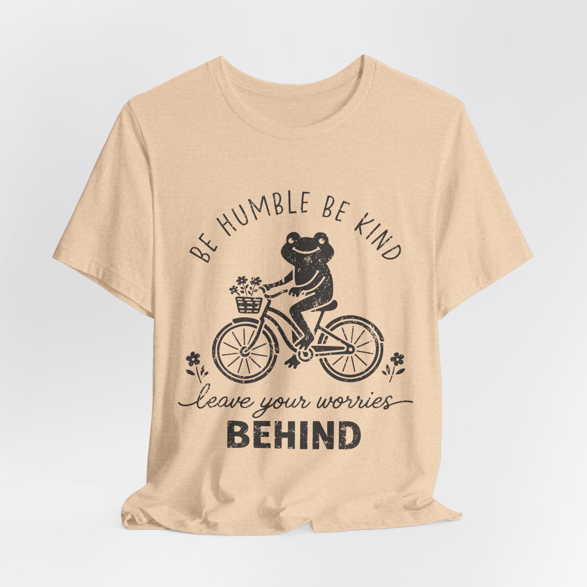 T-Shirt — "Be Humble Be Kind" Frog on Bike Graphic Tee, "Leave Your Worries Behind"